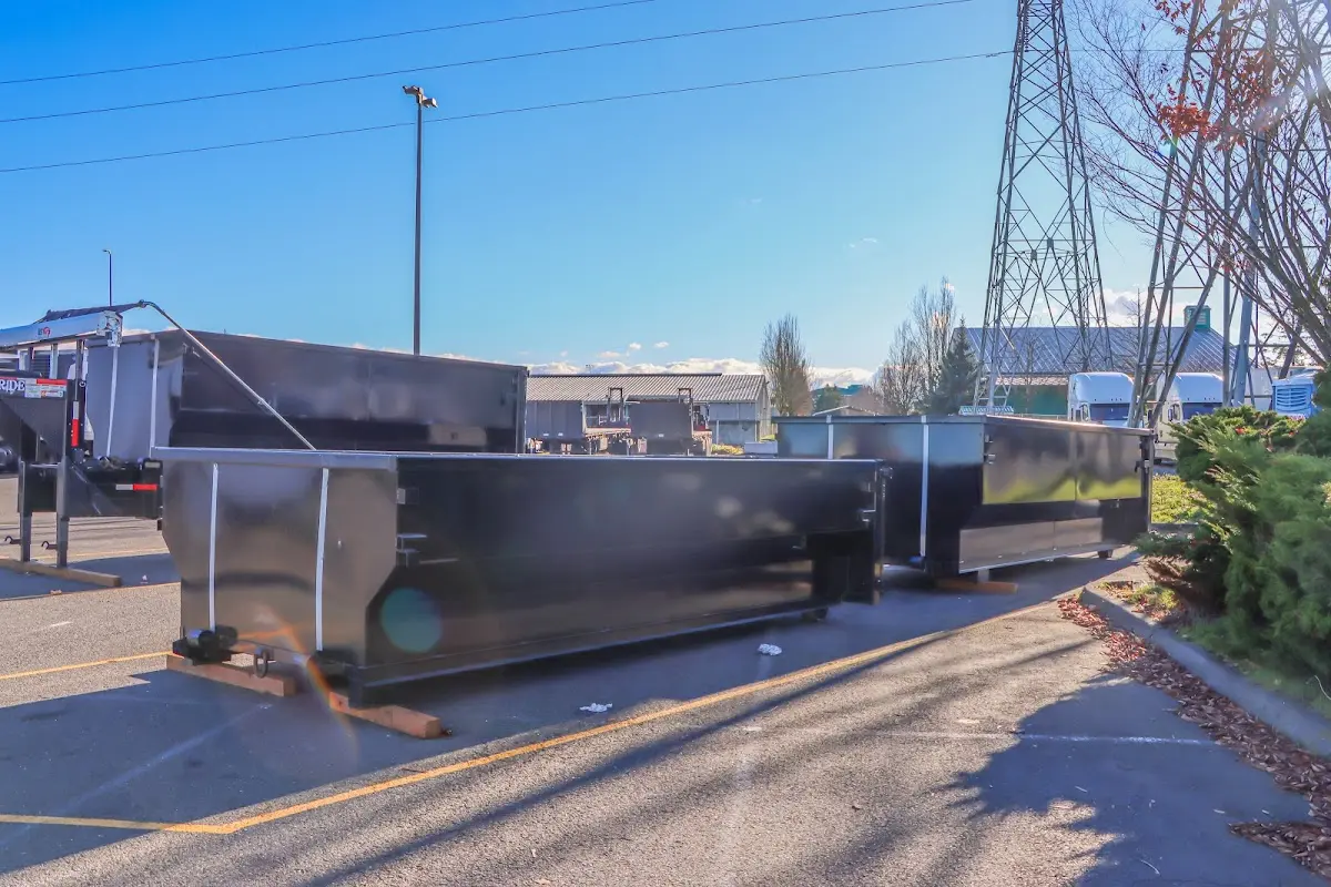 Roll-off dumpster ready for waste disposal at job site for 15 Yard Dumpster Rental in Eaton
